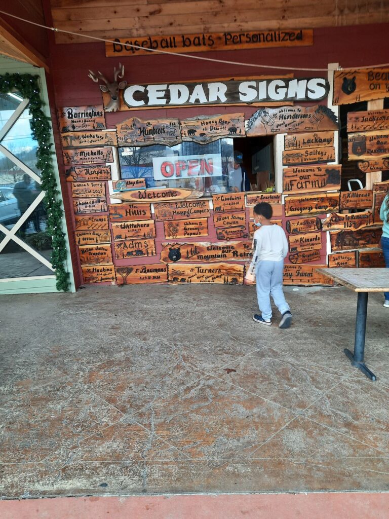 Handmade customizable cedar signs for sales outside of the three bears general store pigeon forge tennessee