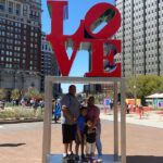 Visiting Philadelphia with kids, Family picture at the Love sign in Love Park in Philadelphia