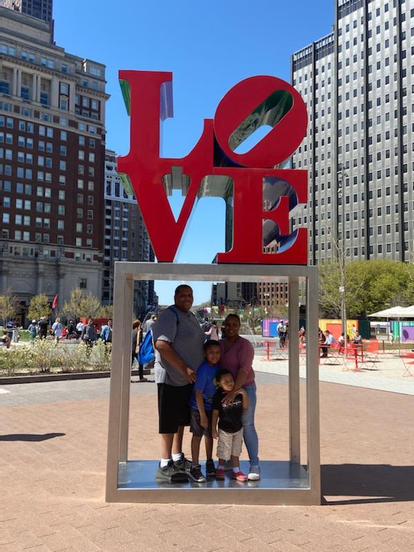 Philadelphia with kids- Family picture at the Love sign in Love Park